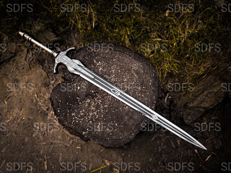 May include: A detailed sword with a silver blade and a decorative hilt, resting on a weathered wooden surface. The blade features a central groove and intricate designs. The hilt has a detailed pattern and a gold-colored pommel. The sword is a fantasy weapon.