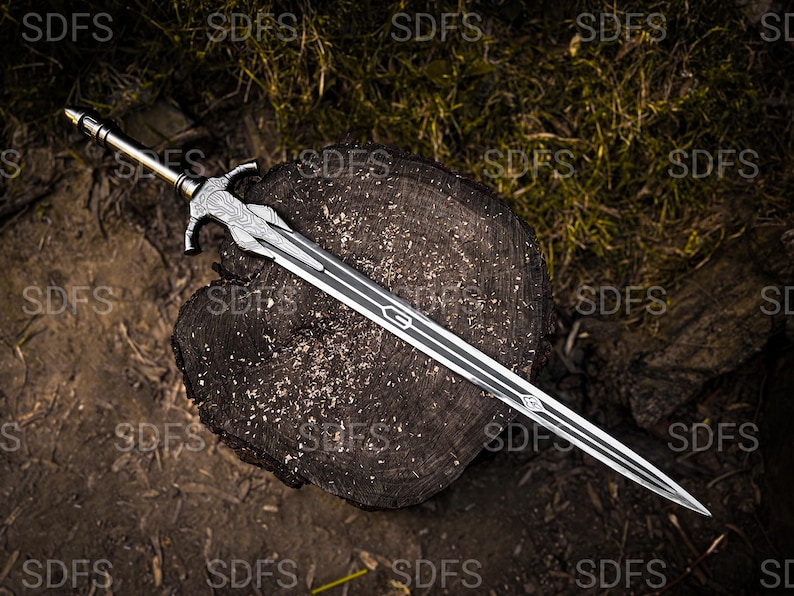 May include: A detailed sword with a silver blade and a decorative hilt, resting on a weathered wooden surface. The blade features a central groove and intricate designs. The hilt has a detailed pattern and a gold-colored pommel. The sword is a fantasy weapon.