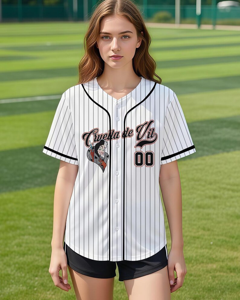 May include: White baseball jersey with black pinstripes, black trim, and the text "Cruella de Vil" in a stylized font. The jersey features a graphic of Cruella de Vil and the number "00".