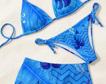 青いトロピカルパームリーフ柄のカップル水着セット、ビキニとトランクス、夏のビーチウェア