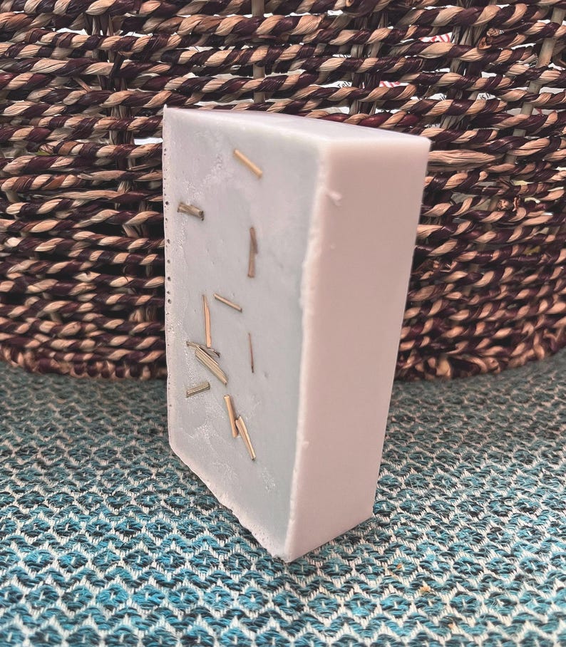 May include: A set of three ceramic mugs with a speckled, matte finish. The mugs are in shades of cream, light gray, and dark gray. Each mug has a simple, minimalist design, perfect for coffee or tea.