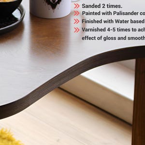 Birch plywood coffee tables set styled in contemporary living room interior
