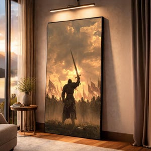 May include: A large framed canvas print depicting a medieval warrior raising a sword towards a bright, golden sky. The artwork features a crowd of soldiers and flags, creating a dramatic and epic scene. The print is displayed in a room with natural light.