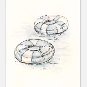 May include: Watercolor illustration of two inflatable pool floats. The floats are round with a blue and white striped pattern. The artwork has a soft, airy feel, suggesting a summer theme.