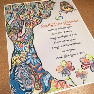 May include: A colorful, hand-drawn tree with flowers and an owl at the top. The text reads "Emily Dove Lorwin" and includes a blessing: "May G-d bless you and guard you, May the light of G-d shine upon you. May G-d be gracious unto you. And give you Peace."