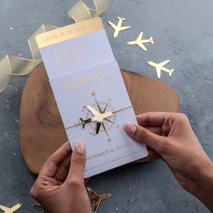 Passport Save the Date with Gold Foil and Airplane Accent — Destination Wedding Boarding Pass