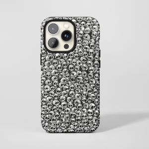 May include: Black and white phone case featuring a repeating pattern of skull illustrations. The case has a black border and cutouts for the camera and buttons. The skulls are detailed with visible eye sockets and teeth.