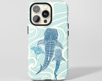 May include: A phone case featuring a blue and white design with a whale shark and a manta ray swimming in a sea of waves. The case has a black border and a glossy finish. The design is detailed and artistic.