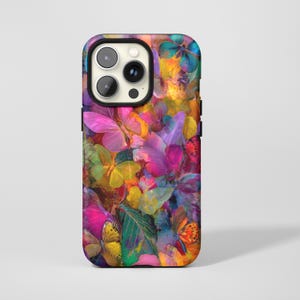 May include: A phone case with a colourful butterfly design. The case displays numerous butterflies in shades of pink, yellow, orange, and blue, creating a lively and artistic pattern. The case has a black border around the camera.