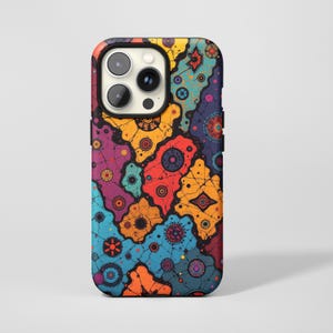 May include: A colorful phone case with a vibrant, abstract design. The case features a pattern of interconnected shapes in shades of orange, yellow, blue, purple, and red. The case has a black border and a camera cutout.