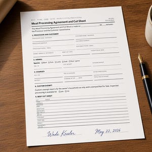 May include: A white Meat Processing Agreement and Cut Sheet document with black text, featuring sections for processor and customer details, animal information, charges, and beef cut options, signed by Wade Kessler and dated May 22, 2026.