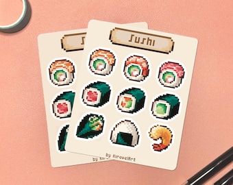 May include: Two sticker sheets featuring pixelated sushi illustrations. The word "Sushi" is at the top of the sheet. The stickers include various sushi rolls, a shrimp, and a rice ball. The artist's name, "by KiraquelArt", is at the bottom.