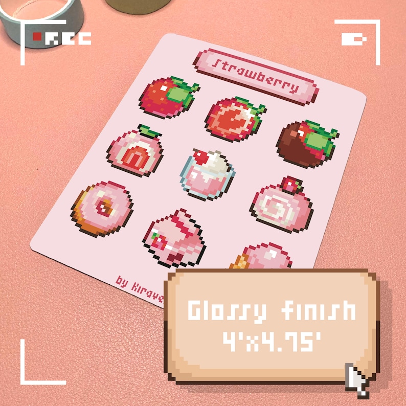 May include: A pink sticker sheet featuring pixelated strawberry-themed illustrations of various desserts. The sheet includes the word "Strawberry" and the text "by Kiraye". The sticker sheet has a glossy finish and measures 4" x 4.75".
