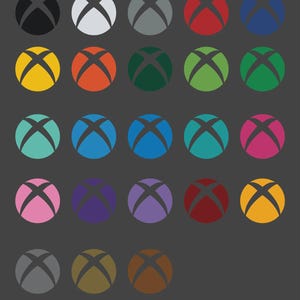 May include: Twenty-one Xbox controller button designs in a variety of colours, including black, white, grey, red, blue, yellow, orange, green, teal, and pink. The buttons are displayed on a dark grey background.