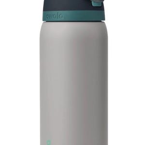 May include: A gray water bottle with a teal and navy blue lid. The bottle has the word "owala" printed on it in teal. The bottle is cylindrical and appears to be made of metal.