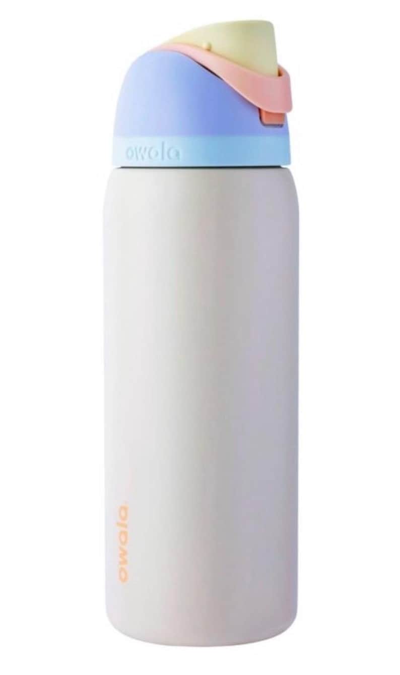 May include: A white Owala water bottle with a pastel color scheme. The lid is light blue, pink, and yellow. The Owala logo is printed in orange on the side of the bottle. This insulated bottle is designed for hydration.