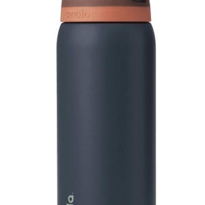 May include: A navy blue insulated water bottle with a brown and orange lid and a green handle. The word "owala" is printed on the bottle. This reusable bottle is designed for hydration on the go.
