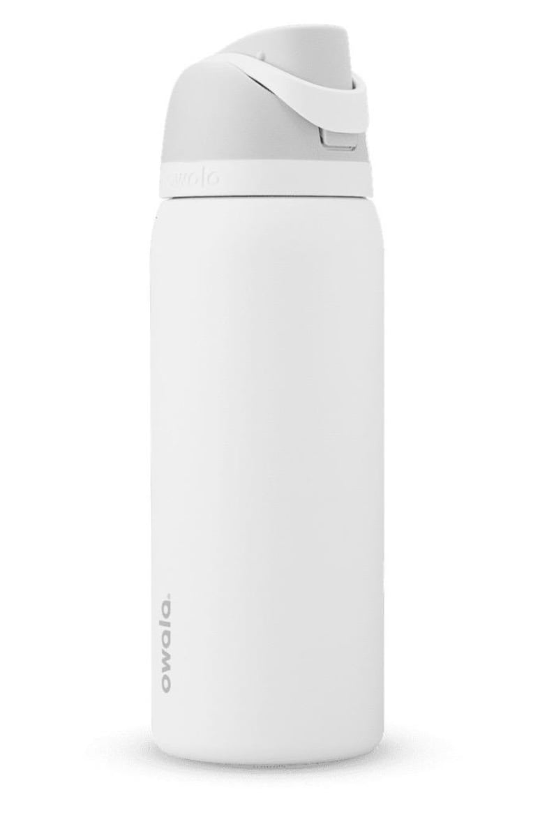 May include: White insulated water bottle with a gray lid and handle. The bottle has a sleek, cylindrical design and features the brand name "owala" printed vertically on the side. The lid has a flip-top design for easy access to the contents.