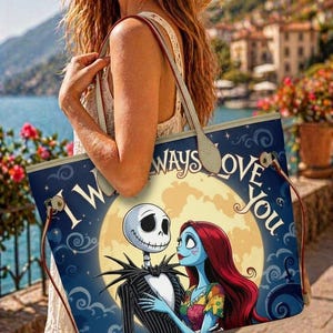 May include: A tote bag featuring a graphic print of Jack Skellington and Sally from The Nightmare Before Christmas against a large yellow moon. The text I WILL ALWAYS LOVE YOU is printed in a stylized font above the characters on a dark blue background.