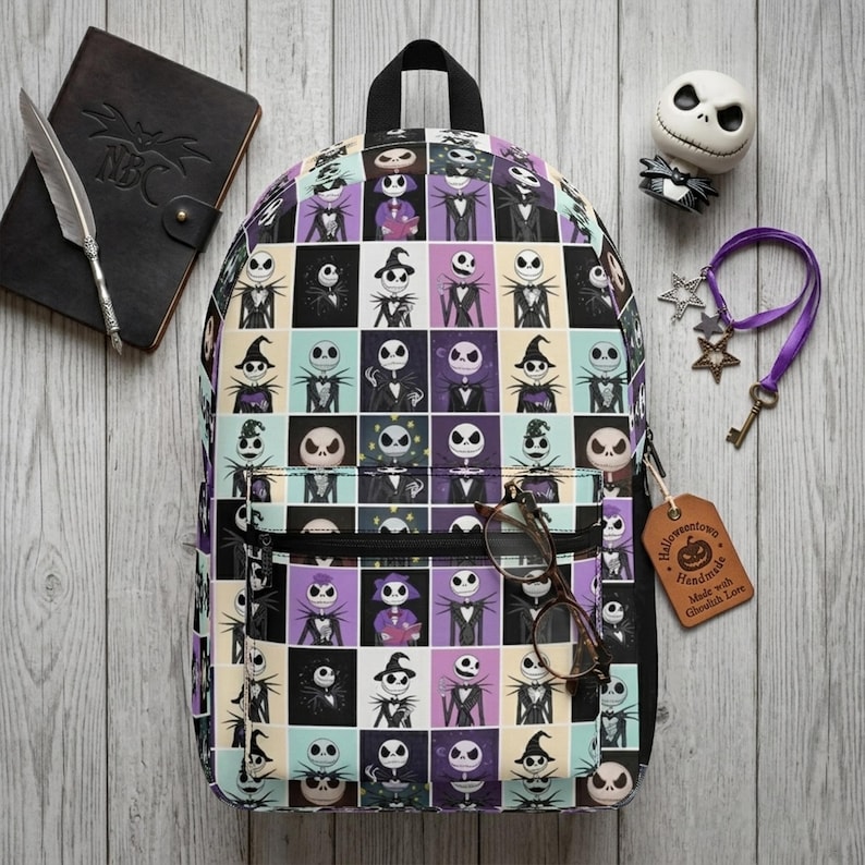 May include: A backpack featuring a grid pattern of Jack Skellington from The Nightmare Before Christmas in various poses, set against purple, black, and cream squares. The bag has a front zippered pocket and a black top handle for carrying.