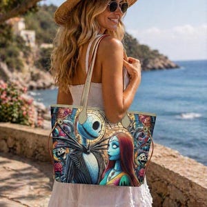 May include: A tote bag featuring a colorful, stained-glass style print of Jack Skellington and Sally from The Nightmare Before Christmas. The bag has two thin, light-colored shoulder straps and a rectangular shape with a wide, open top design.