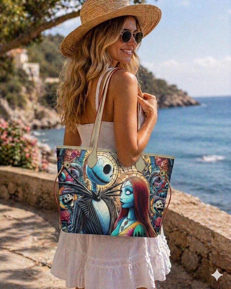 May include: A tote bag featuring a colorful, stained-glass style print of Jack Skellington and Sally from The Nightmare Before Christmas. The bag has two thin, light-colored shoulder straps and a rectangular shape with a wide, open top design.