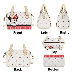 May include: White handbag with red heart pattern and Minnie Mouse graphic. Features a red and black stripe at the bottom. Includes beige handles and a detachable shoulder strap. Multiple views: front, back, sides, top, and bottom.