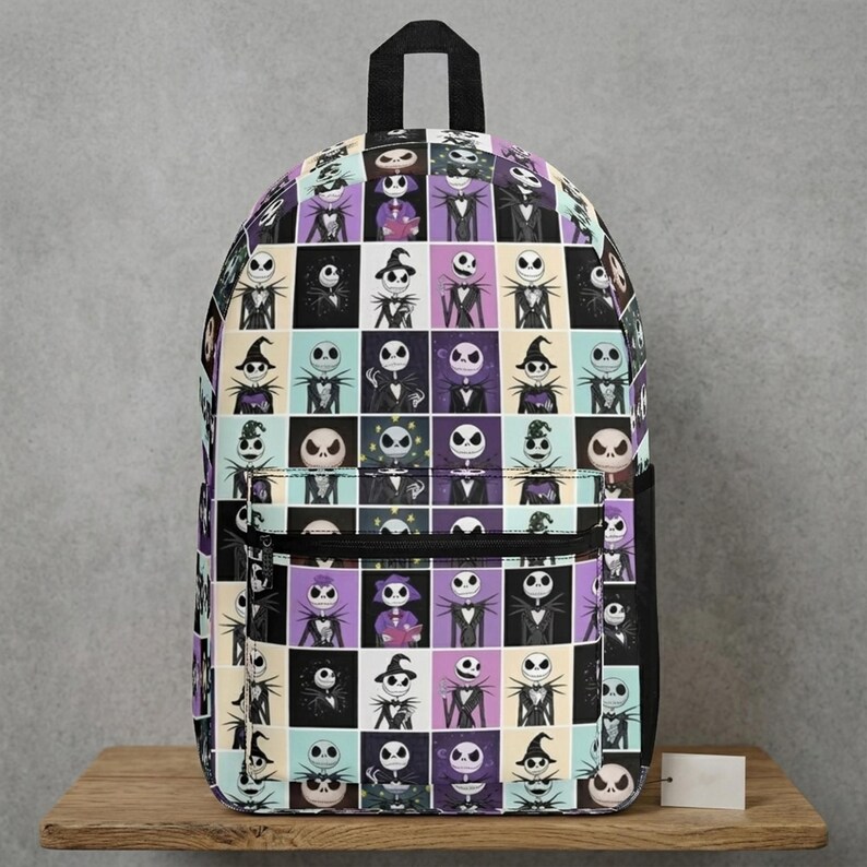 May include: A backpack featuring a grid pattern of various illustrations of Jack Skellington from The Nightmare Before Christmas. The design includes multiple poses and outfits in a color palette of black, white, purple, and light blue on a fabric bag.