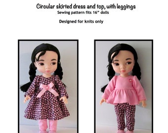May include: A sewing pattern for a circular skirted dress and top with leggings for 16-inch dolls. The pattern is designed for knit fabrics. The image shows two dolls wearing the finished garments. The doll on the left is wearing a black and pink floral print dress and leggings. The doll on the right is wearing a pink top and leggings with a black and pink floral print.