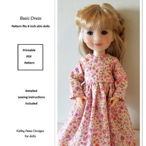 May include: A printable PDF pattern for a basic dress for 8 inch slim dolls. The pattern includes detailed sewing instructions. The image shows a doll wearing a pink dress with a floral print.