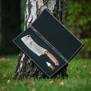 May include: A trio of ceramic mugs with a speckled, matte finish in cream, light grey, and dark grey. Each mug features a simple, minimalist design, ideal for tea or coffee.