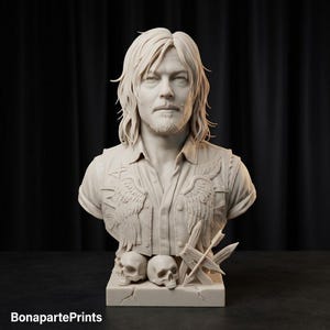 May include: A monochromatic bust sculpture of a man with shoulder-length hair and a goatee, wearing a button-down shirt and a vest featuring wing motifs. The base includes two skulls and crossed arrows. The text BonapartePrints is visible.