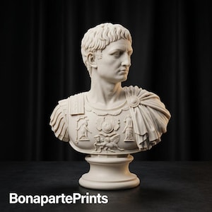 May include: A cream-coloured bust sculpture of a Roman emperor with short, textured hair, wearing an ornate breastplate featuring relief carvings of figures and a draped cloak fastened with a circular brooch, set on a pedestal base.