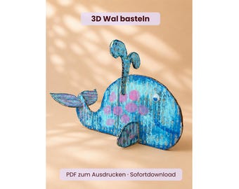 Könnte beinhalten: Ein 3D-Wal aus Wellpappe, bemalt in Blautönen mit rosa Punkten. Er hat ein Wackelauge, eine vertikale Fontäne und eine Schwanzflosse. Der Text "3D Wal basteln" und "PDF zum Ausdrucken · Sofortdownload" ist auf dem Bild zu sehen.