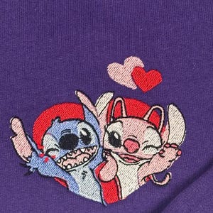 two cartoon characters, a blue one and a pink one, who appear to be in a loving embrace.