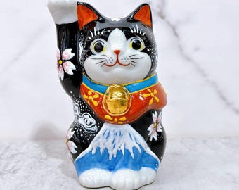 Kutani-yaki Maneki Neko: Japanese Porcelain Lucky Cat with Cherry Blossoms