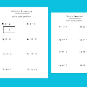 May include: Two white sheets of paper with division exercises printed in black ink. The text "Division Exercises" and "Solve each problem" are at the top. Problems include equations like 6+2, 8+4, and 9+3. A rectangle with the number 3 is drawn.