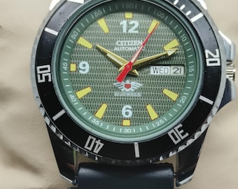 Orologio automatico Citizen vintage, quadrante verde, lunetta girevole