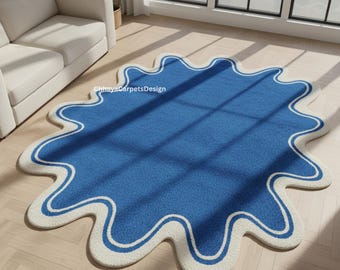 Modern blauw-wit golvend tapijt met rand - handgetuft ontwerp