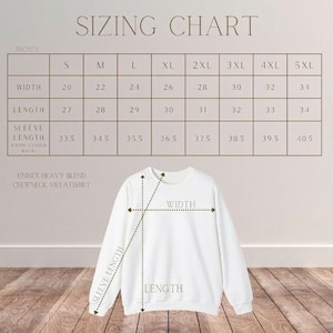 May include: A white unisex heavy blend crewneck sweatshirt with a sizing chart. The chart displays measurements in inches for width, length, and sleeve length, ranging from size S to 5XL. The text "SIZING CHART" is at the top.
