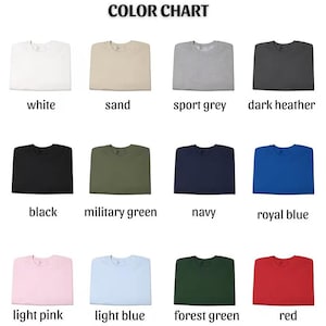 May include: A color chart displaying various sweatshirt colors. The chart includes white, sand, sport grey, dark heather, black, military green, navy, royal blue, light pink, light blue, forest green, and red.