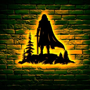 May include: A black metal wall art silhouette of a medieval warrior with a sword, standing on a hill with trees, against a brick wall. The art is illuminated with a warm yellow glow, creating a dramatic effect.