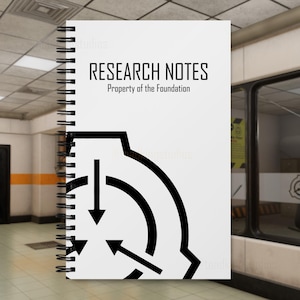 May include: A white spiral-bound notebook featuring the black text RESEARCH NOTES and Property of the Foundation at the top, with a large black circular logo containing three inward-pointing arrows printed on the lower half of the cover.