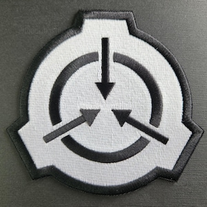 May include: Embroidered patch featuring the SCP Foundation logo. The patch has a white background with a black border and a black circular design with three arrows and a downward-pointing arrow in the center. The patch is a unique accessory.
