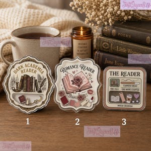 May include: Three decorative acrylic shaker charms featuring book-themed illustrations. The first reads Dark Academia Reader, the second Romance Reader, and the third The Reader with a progress bar. Each charm contains small loose icons inside.