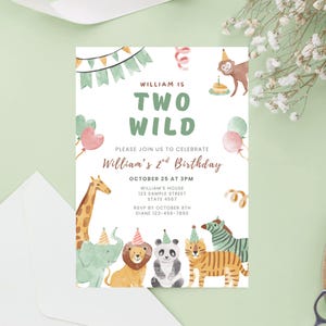 May include: A birthday invitation with a watercolor safari animal theme. The text reads "William is Two Wild" with details for the party. The invitation features a giraffe, elephant, lion, panda, tiger, and zebra.