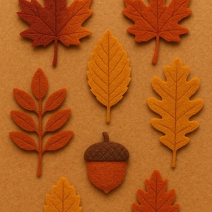 May include: An assortment of felt autumn leaves and an acorn in shades of orange, brown, and yellow. The leaves include maple, oak, and other leaf shapes, arranged on a solid orange background. Perfect for fall-themed crafts and decorations.