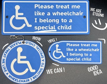 May include: Blue signs and a keychain featuring the wheelchair symbol and the text "Please treat me like a wheelchair, I belong to a special child." The signs are in various shapes. The keychain is circular.
