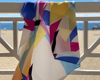 A large abstract colorful, bright, and fun silk scarf.