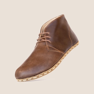 Premium full-grain leather shaped by hand for perfect comfort.